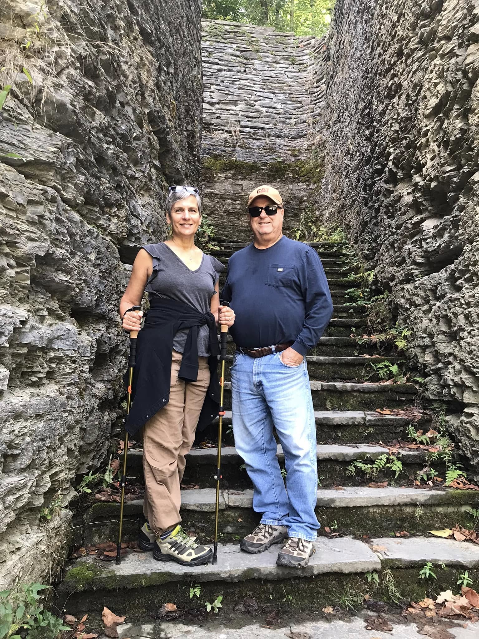 Pam outdoors on a hike with her husband
